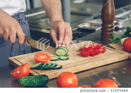 Man japanese restaurant chef cooking in the 31455464