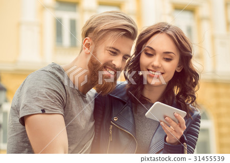 Young couple tourists city walk together vacation Young couple tourists city walk together vacation 31455539