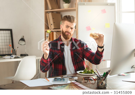 Young man architect working in the office 31455809