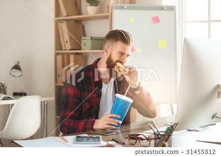 Young man architect working in the office Young man architect working in the office 31455812