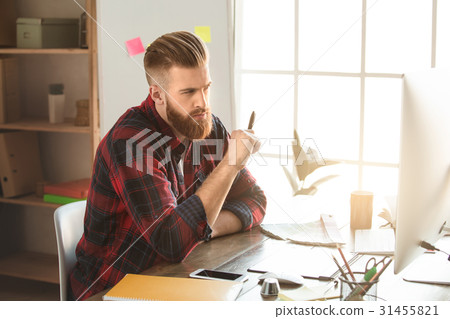 Young man architect working in the office Young man architect working in the office 31455821