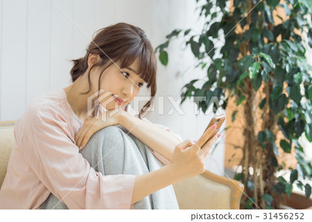 Female twenties relaxing in the room 31456252