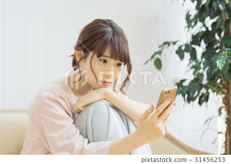 Female twenties relaxing in the room 31456253