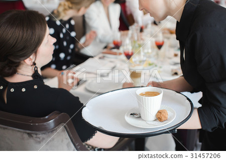 Crop waiter taking order 31457206