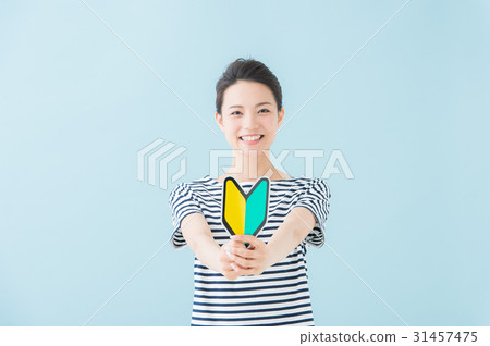 A woman with a beginner's mark (light blue) 31457475