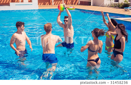 Group of cheerful couples friends playing water Group of cheerful couples friends playing water 31458236