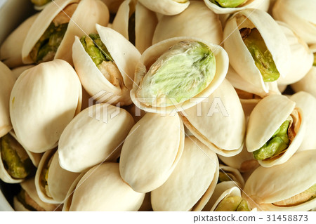 Roasted salted Pistachios are dried nuts close up Roasted salted Pistachios are dried nuts close up 31458873