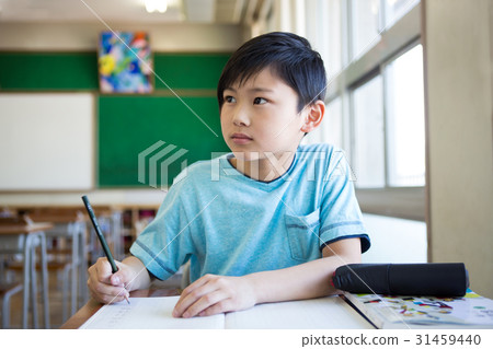 A boy studying in the classroom 31459440