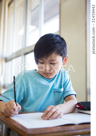A boy studying in the classroom 31459442