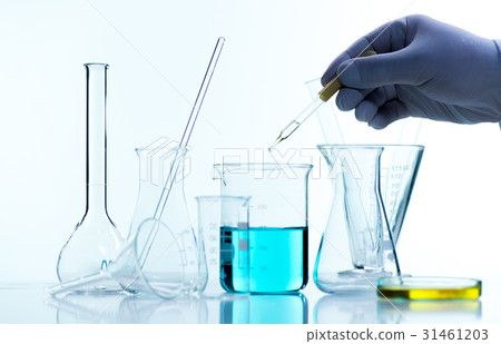 Liquid drop from laboratory glass pipette to test tube Liquid drop from laboratory glass pipette to test tube 31461203