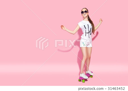 Young woman riding skateboard 31463452