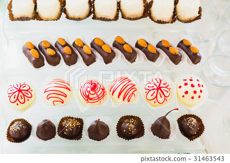 Different kinds of baked sweets on a buffet 31463543
