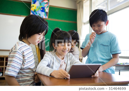 Elementary school students using tablets Elementary school students using tablets 31464699