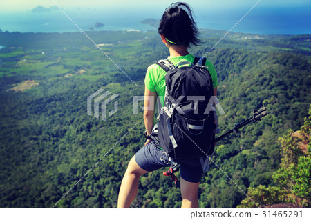 young woman enjoy the view on mountain peak young woman enjoy the view on mountain peak 31465291