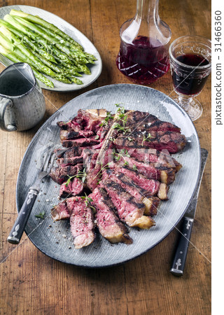Wagyu T-Bone Steak with Green Asparagus on Plate 31466360