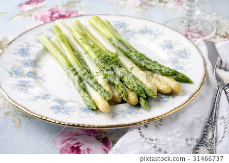 Green and White Asparagus on Plate 31466737