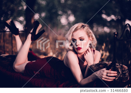 Beautiful and elegant blonde woman with red lips Beautiful and elegant blonde woman with red lips 31466880