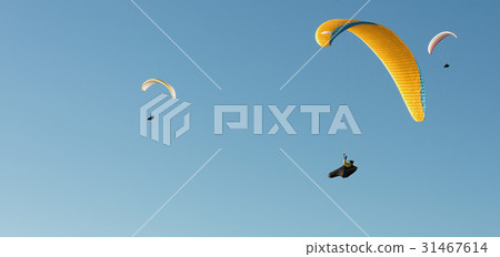 Group of paragliding flying in the blue sky 31467614