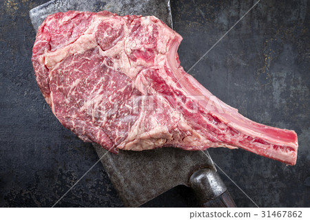 Wagyu Tomahawk Steak on old Kitchen Cleaver 31467862