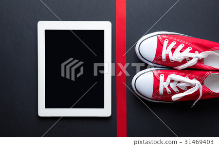 tablet, gumshoes and ribbon tablet, gumshoes and ribbon 31469403