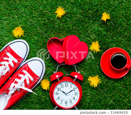 gumshoes, box, cup of coffee and alarm clock 31469420