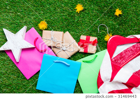 shopping bags, gifts, jacket on hanger and toy shopping bags, gifts, jacket on hanger and toy 31469443