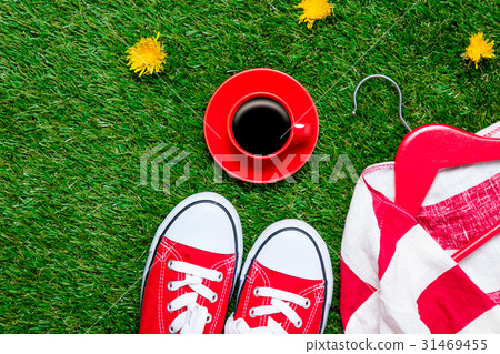 gumshoes, jacket on hanger and cup of coffee 31469455