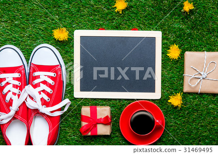 blackboard, gifts, gumshoes and cup of coffee 31469495