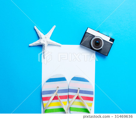 sandals, camera, starfish and sheet of paper sandals, camera, starfish and sheet of paper 31469636