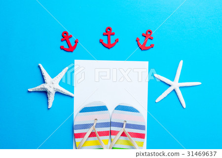 sandals, sheet of paper, starfishes and toys 31469637
