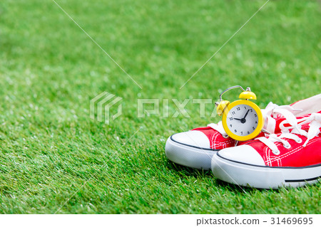 gumshoes and alarm clock 31469695