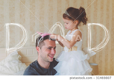 Little girl with father wearing crowns. Fathers 31469807