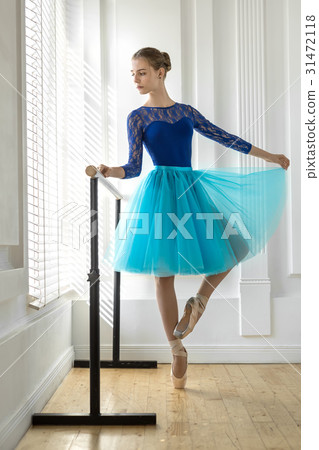 Ballerina is training on barre 31472118