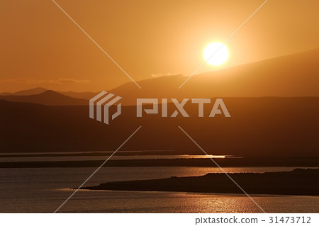 Sunset with Lake and Hilly Landscape 31473712