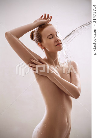 Sexy beautiful naked woman in splashes of water. Sexy beautiful naked woman in splashes of water. 31473714