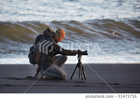 Photographer with tripod Photographer with tripod 31473716