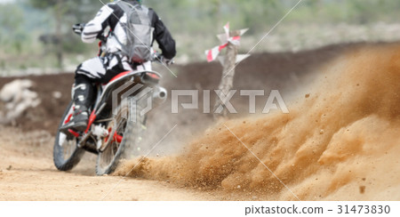 Dust splash from enduro motocycle race 31473830