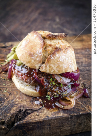 Hamburger with Chili Relish on old Cutting Board Hamburger with Chili Relish on old Cutting Board 31476016