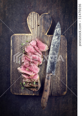 Barbecue Strip Steak on Cutting Board 31476036