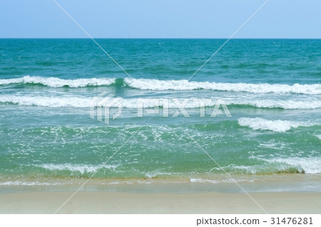 Waves in the ocean and sand on the beach Waves in the ocean and sand on the beach 31476281