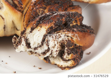 Home sweet roll with poppyseeds 31476529