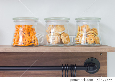 salty crackers in glass bottle on wooden shelf salty crackers in glass bottle on wooden shelf 31477566