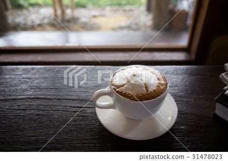 Coffee cup at coffee shop on glasses table Coffee cup at coffee shop on glasses table 31478023