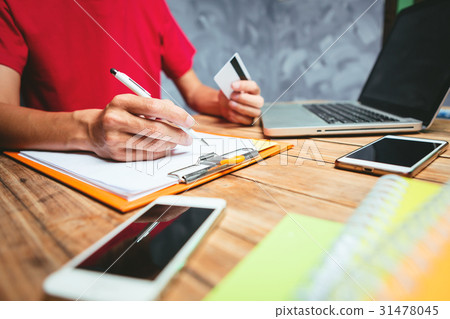 Young asian businessman working hard 31478045