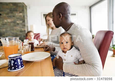 Young interracial family with little children 31478098