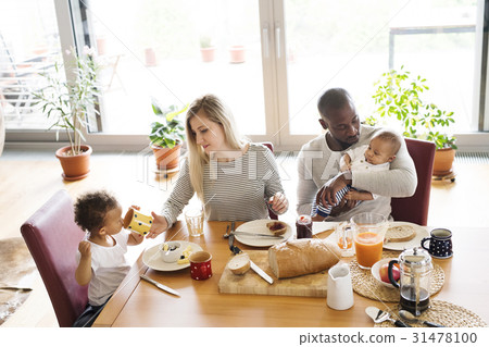 Young interracial family with little children 31478100