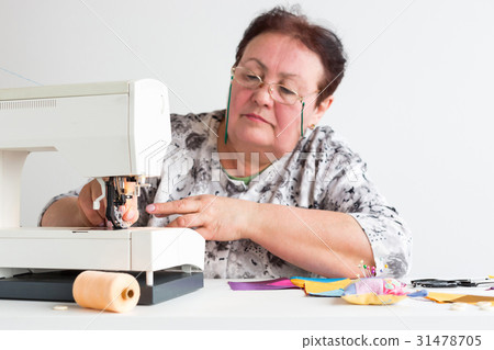 patchwork and quilting at the workshop of a tailor 31478705