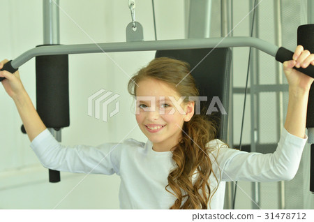 Little girl doing exercises  31478712