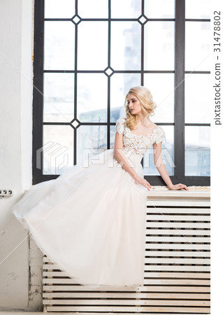 fashionable wedding gown, beautiful blonde model fashionable wedding gown, beautiful blonde model 31478802