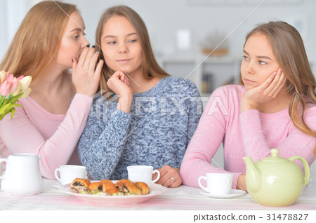 Teenage Girls Gossiping Stock Photo